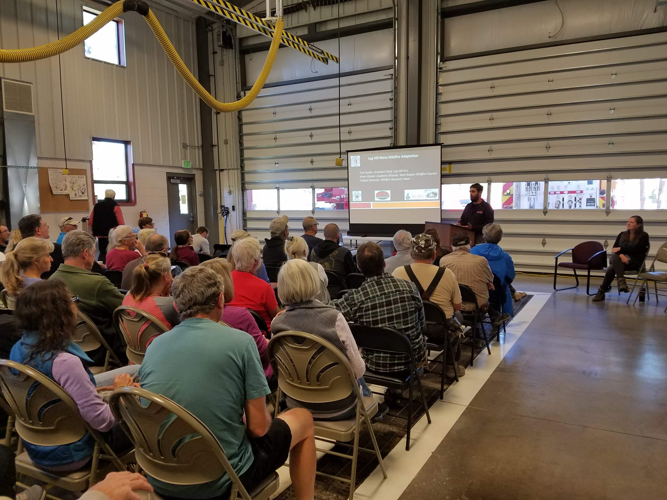 Research team member Jamie Gomez presents survey results to community members in Town of Mountain Village, Colorado. Researchers determned that homeowners were willing to remove trees to reduce wildfire risk but almost many viewed homeowner association restrictions on tree cutting as a barrier.