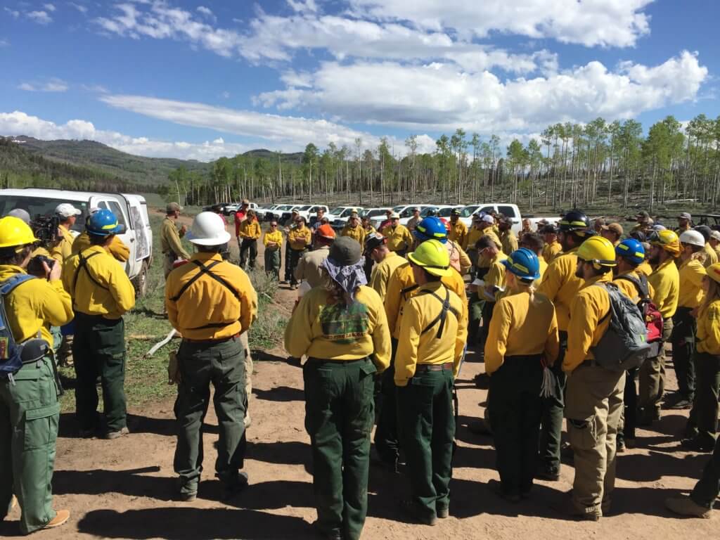 Members of the research and fire team at a briefing prior to the Manning Creek stand replacement prescribed fire ignition, on the Richfield Ranger District, Fishlake National Forest, Utah, June 20, 2019.
